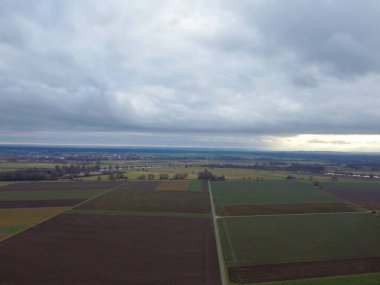 Green fields in Bavaria in the valley with aerial view in winter