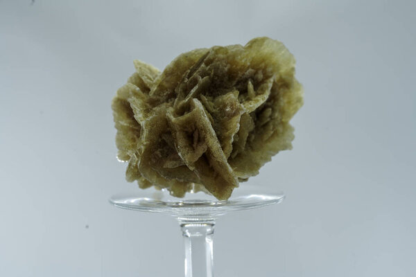 Gypsum rose with a crystal on a cut out background, Crystals resembling the shape of a rose