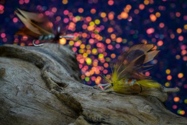 Fishing hook on a background of blue and white bokeh