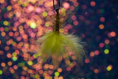 Fishing hook on a dark background. Close-up. Selective focus.