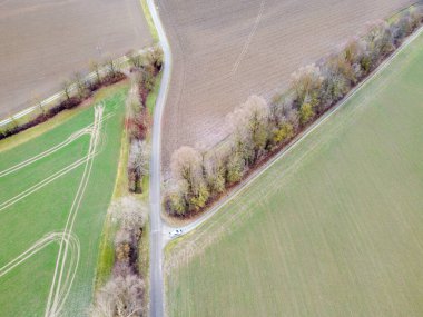 Green fields in Bavaria in the valley with aerial view in winter