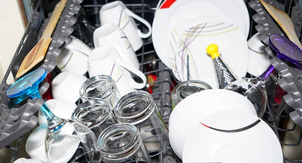 cutlery and glasses and plates cleaned in the dishwasher, household work