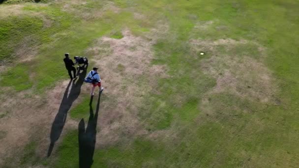 Two Caucasian Male Golfers Walking Golf Course Sunny Day Wearing — Stock Video