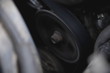 Close-up of the engine compartment of an old car.