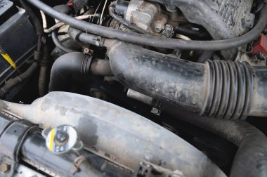 Close-up of the engine compartment of an old car.