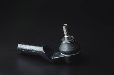 Close-up of Tie Rod or Ball Joints. New spare part for steering tie rod. Trade in spare parts or car service. Selective focus.