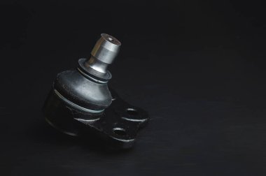 Close-up of Tie Rod or Ball Joints. New spare part for steering tie rod. Trade in spare parts or car service. Selective focus.