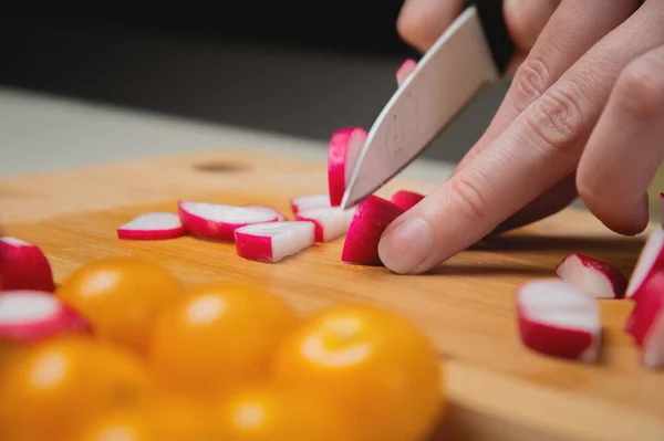 Close Woman Cuts Radish Kitchen Knife Cutting Wooden Board Cooking — Stock Photo, Image