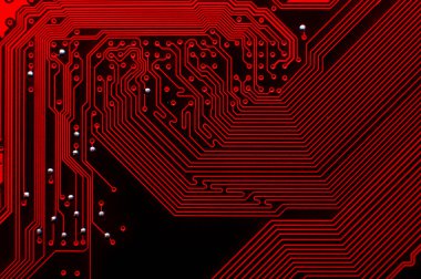 Bir bilgisayar plakasının en üstteki görünümü bir arka plan olarak. Baskılı devre kartının makro görüntüsü, yollar ayrıntılı olarak görülebilir. Reklamcılık için soyut teknoloji geçmişi.