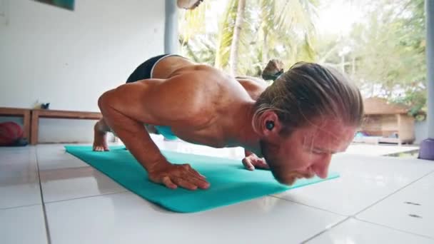 Young Fit Man Does Yoga Caucasian Man Performs Stretching Exercises — Stock Video
