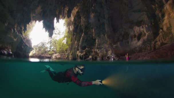 Freediver Swims Cave Torch — Stock Video