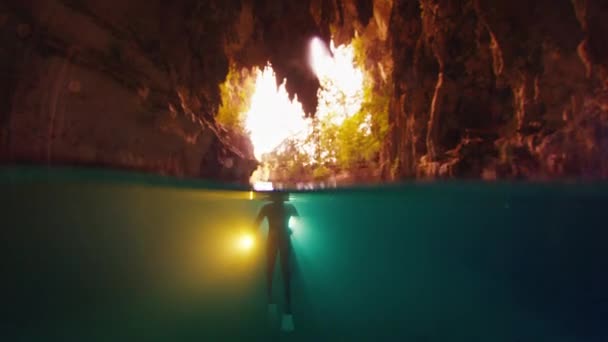 Freediver Swims Cave Torch — Stock Video