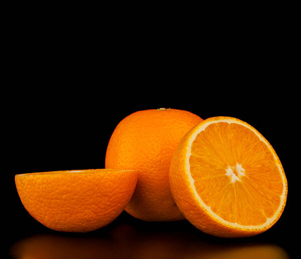 Oranges isolated on black background. Place for text. Top copy space
