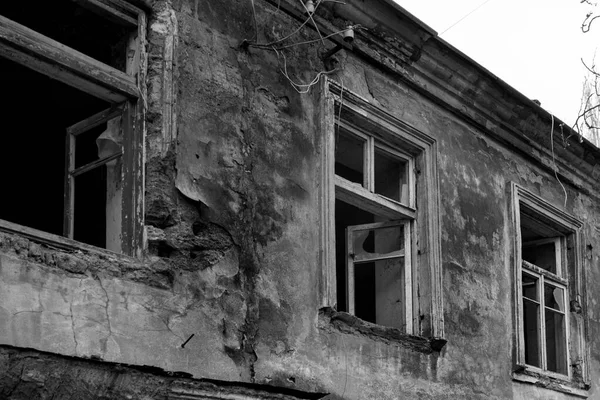 stock image Old destroyed houses. War, destruction, restructuring. abandoned, useless houses. Restitution, bombing, consequences of social and military conflicts.