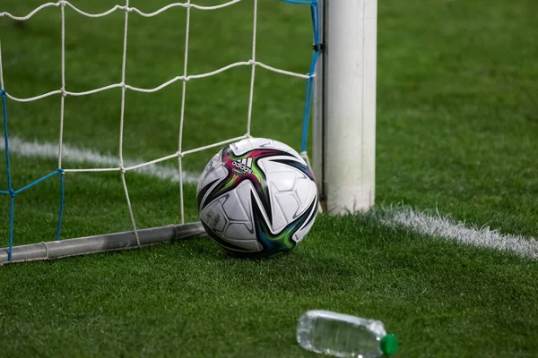 stock image ODESSA, UKRAINE - Nov 11, 2021: Friendly football match between football teams FC Ukraine and FC Bulgaria. Official soccer ball of tournament on natural green grass of football field in penalty area