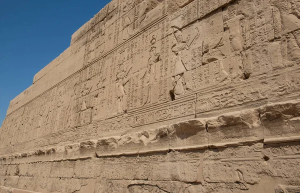 Hieroglypic carvings on wall at the ancient egyptian Temple of Khonsu in Karnak Luxor Egypt