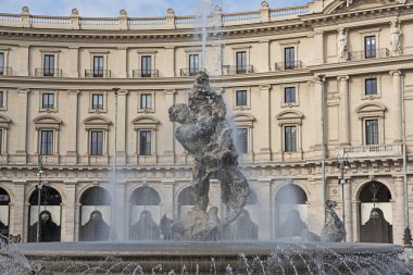 Closeup detail showing ornate facade exterior of building in rome Italy with fountain of the naiads at piazza della Repubblica clipart