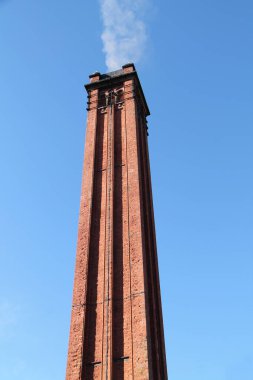 Smoke Rising from a Vintage Brick Built Tall Chimney.