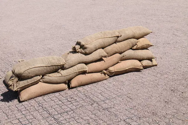 stock image A Pile of Sand Filled Hessian Sack Sandbags.