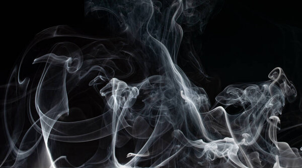 Abstract smoke on a dark background .