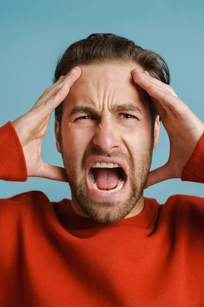 Young Shocked Man Wearing Red Sweater Screaming Camera Isolated Blue — Stock Photo, Image