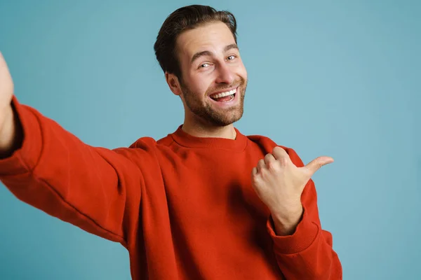 Young Bristle Man Pointing Finger Aside While Taking Selfie Photo — Stock Photo, Image