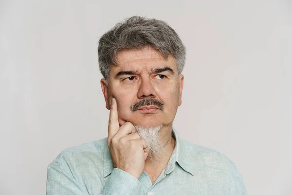 Mature Puzzled Man Grey Beard Posing Looking Aside Isolated White — Stock Photo, Image