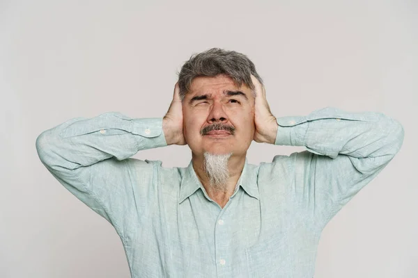 Mature Man Grey Bread Grimacing Covering His Ears Isolated White — Stock Photo, Image