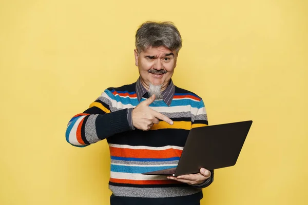 Mature Man Grey Beard Holding Pointing Finger His Laptop Isolated — Stock Photo, Image