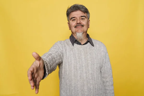 Senior Grey Man Smiling Stretching His Hand Camera Isolated Yellow — Stock Photo, Image