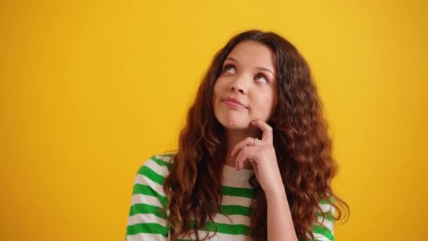 Pensive Curly Haired Brunette Woman Thinking Something Yellow Studio — Stock Video