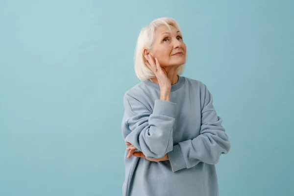 Beautiful Thoughtful Senior Woman Blue Pullover Looking Upward Isolated Blue — Stock Photo, Image