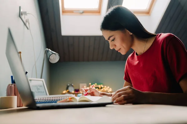Young Hispanic Woman Writing Notes While Working Laptop Home — Foto Stock
