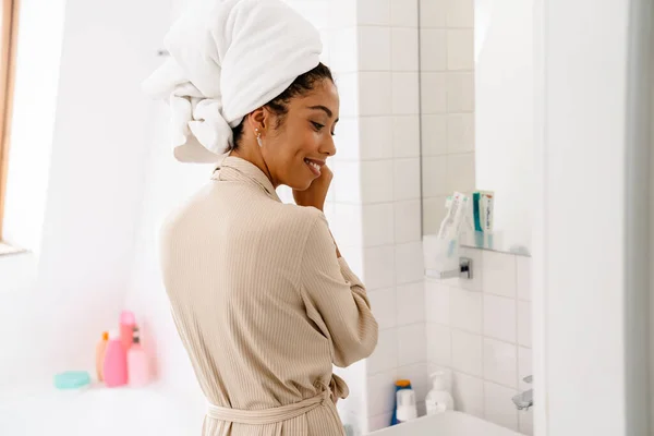 African American Young Woman Towel Head Smiling Wearing Earrings Bathroom — Stock Photo, Image