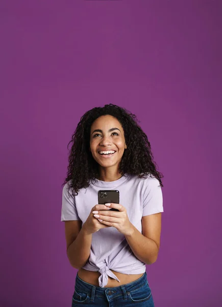 Young Black Woman Using Mobile Phone Laughing Isolated Purple Background — Stock Photo, Image