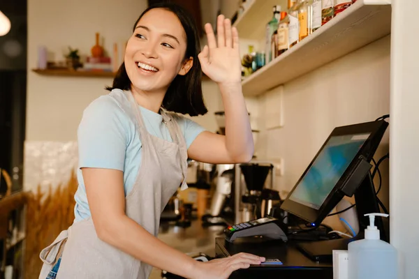 Asian Barista Woman Wearing Apron Gesturing While Working Cash Register — Stock Photo, Image