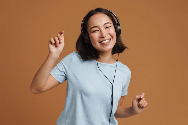 Young Asian Woman Headphones Dancing While Listening Music Isolated Beige — Stock Photo, Image