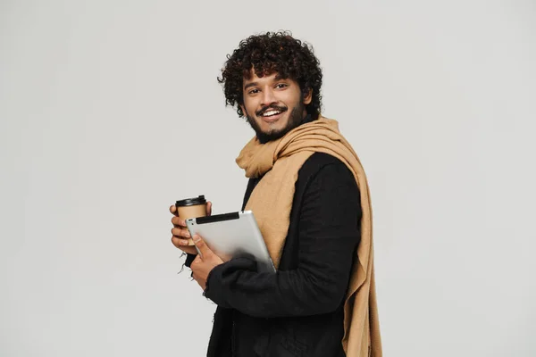 Young Adult Indian Smiling Curly Man Scarf Coffee Tablet Looking — ストック写真