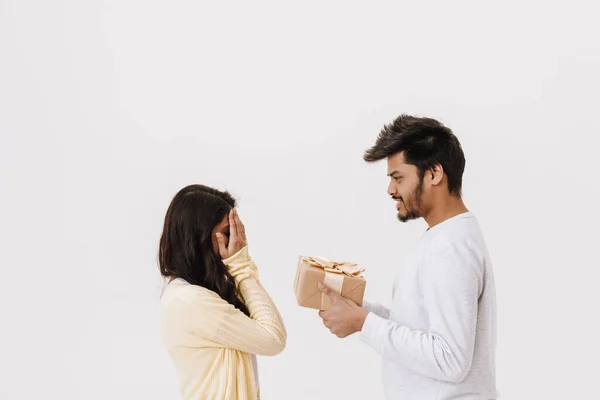 Young Indian Man Giving Present Box His Girlfriend Isolated White — Stock Photo, Image