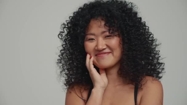 Portrait Cute Brunette Asian Woman Blowing Air Kiss Camera Grey — Video