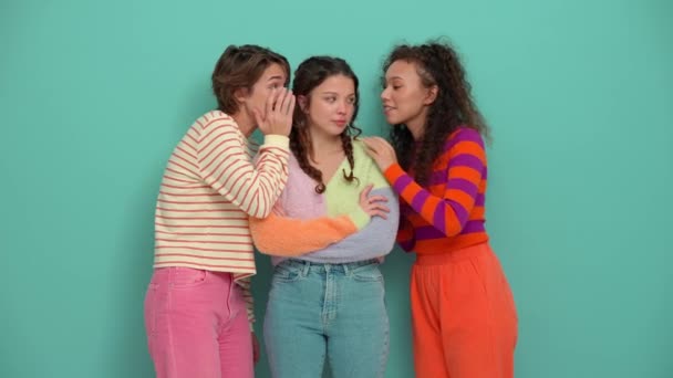 Three Pretty Young Girls Telling Secrets Turquoise Studio — Vídeos de Stock
