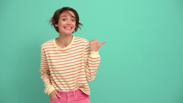 Funny Young Woman Short Hairstyle Showing Thumb Gesture Pointing Copyspace — Stock video