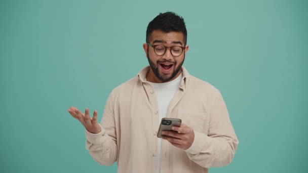 Lovely Middle Eastern Young Man Talking Camera Typing Phone Turquoise — Stock Video