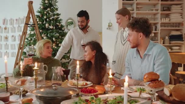 Laughing Multinational Friends Celebrating Christmas Home — Stock Video