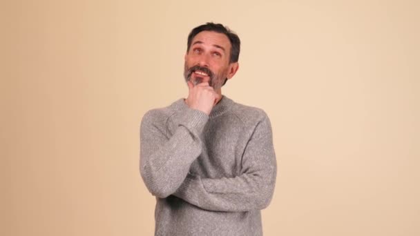 Positive Adult Bearded Man Wearing Grey Sweater Agrees Something Beige — Vídeo de stock