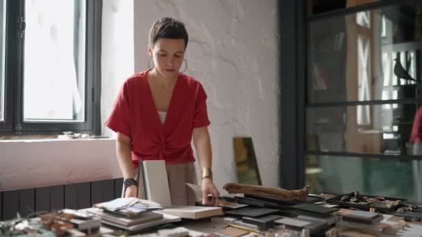 Confident Brunette Woman Architect Puts Laminate Samples Table Office — Video Stock