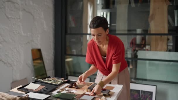 Serious Brunette Woman Architect Puts Colour Samples Table Office — Stock video