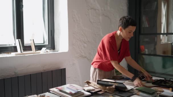 Concentrated Brunette Woman Architect Puts Colour Samples Table Office — Video Stock