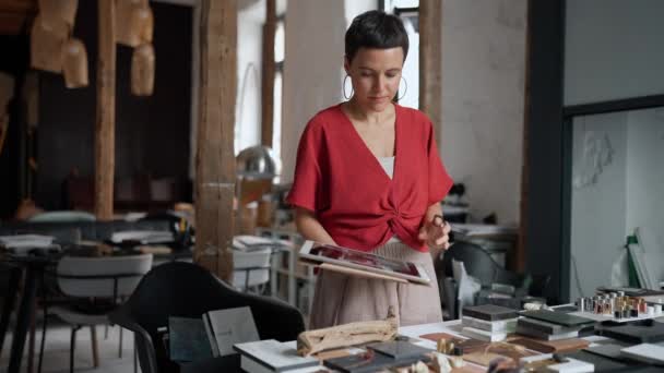 Serious Short Haired Woman Architect Working Tablet Looking Samples Table — Stock Video