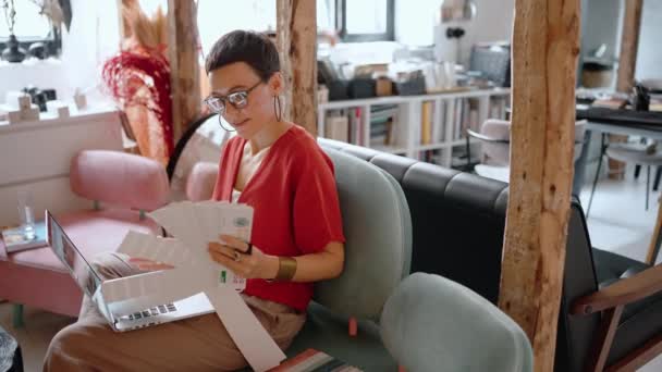 Positive Brunette Woman Architect Eyeglasses Working Laptop Selects Colour Palette — Video Stock